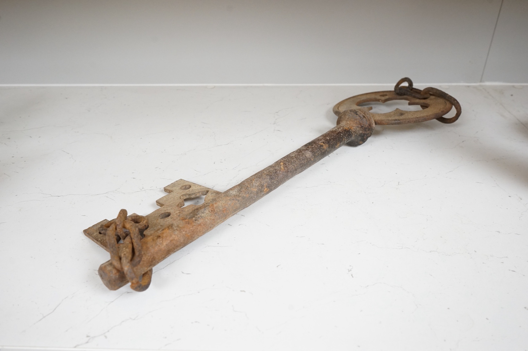 An oversized cast iron shop sign advertising key, 50cm wide. Condition - fair
